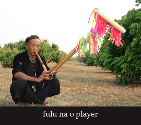 Black Lisu harmonica player